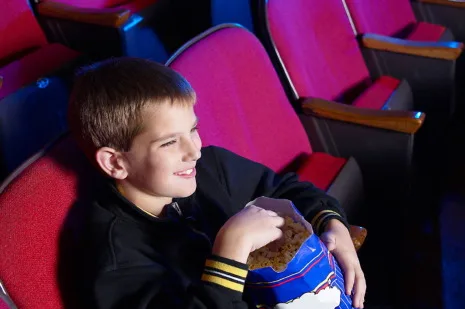 a boy watching a movie