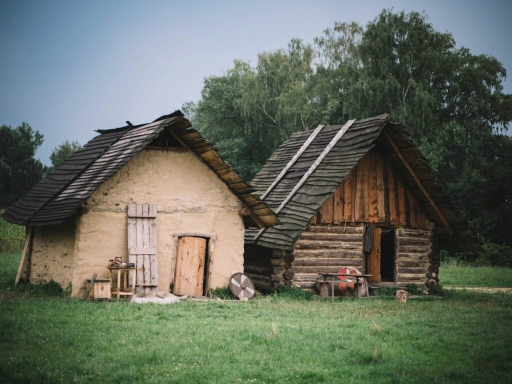 two brown houses near trees