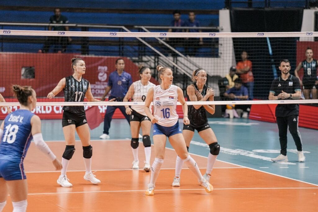 Volleyball players in action during a match