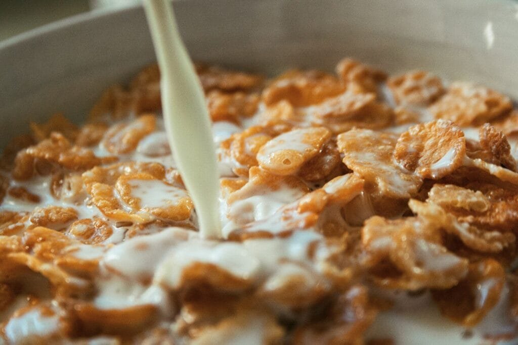 white plastic spoon on brown and white dish