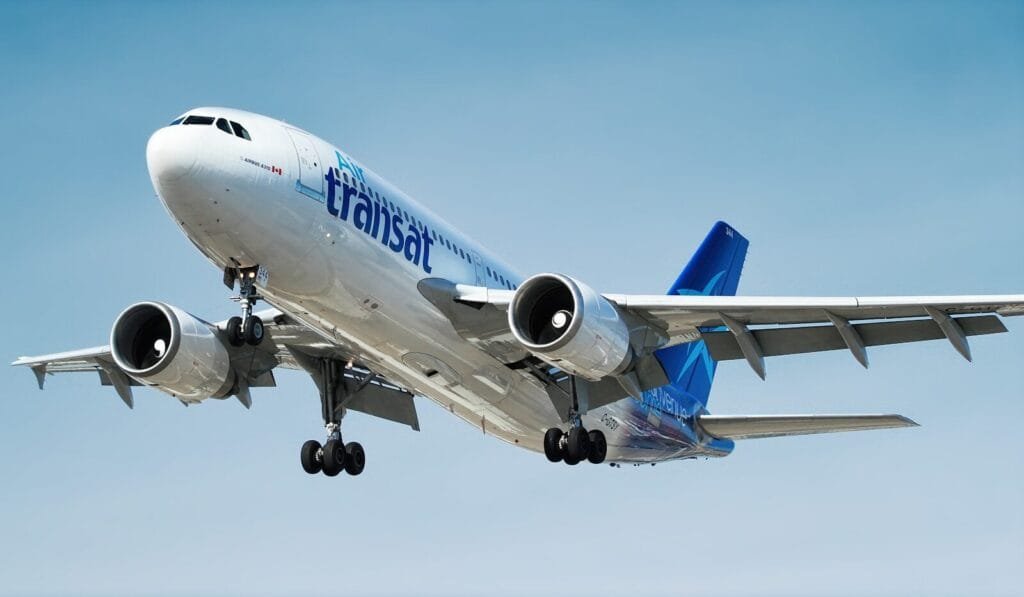 photo of gray and blue airplane